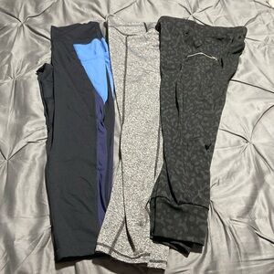 3 pairs of leggings, all as a set one medium and 2 s/m.